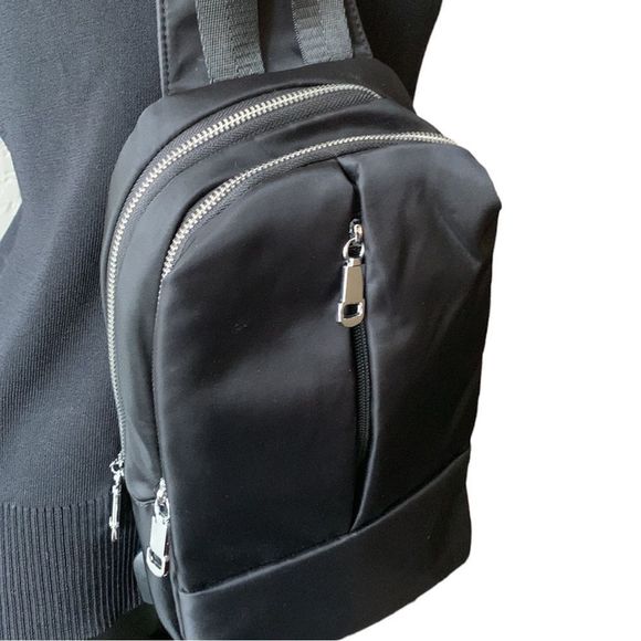 Handbags - SLING Bag Crossbody Backpack with Built -In USB Charging Port for Travel - Black